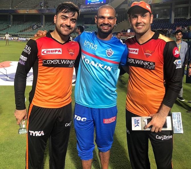 Shikhar Dhawan with Rashid Khan and Mohammad Nabi