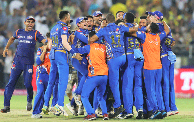 Mumbai Indians players celebrate after defeating Chennai Super Kings by one run to win the Indian Premier League title in Hyderabad on Sunday. This is their 4th IPL crown.