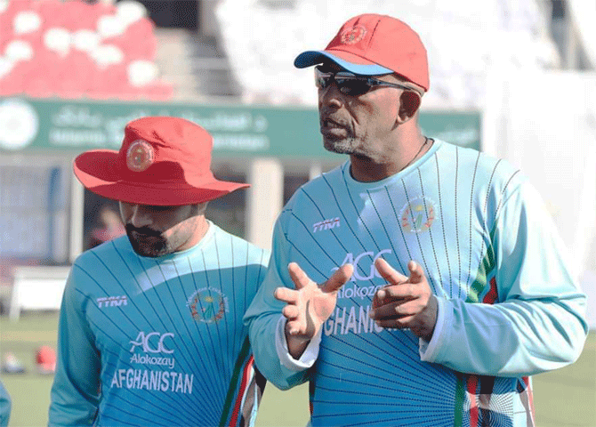 Afghanistan coach Phill Simmons and spinner Rashid Khan during a training session