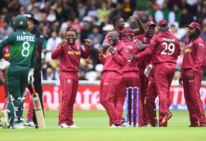 The West Indians celebrate the fall of a Pakistan wicket at Trent Bridge on May 31, 2019.