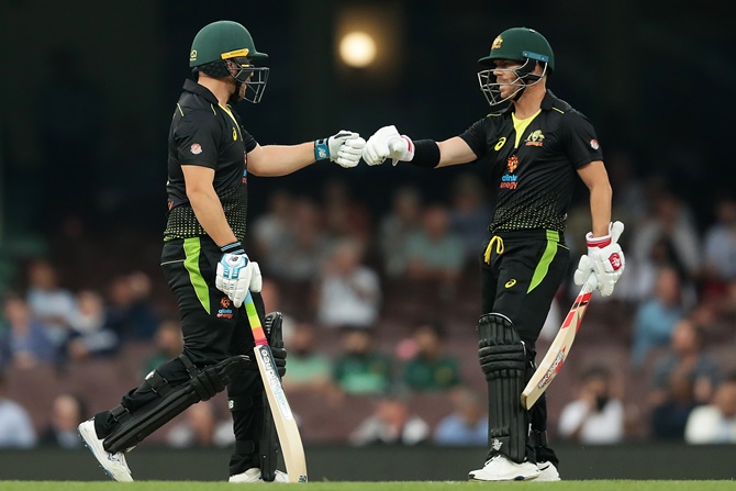 Australia openers Aaron Finch and David Warner celebrate a boundary during Game 1 of the Twenty20 series against Pakistan at the Sydney Cricket Ground on Sunday.