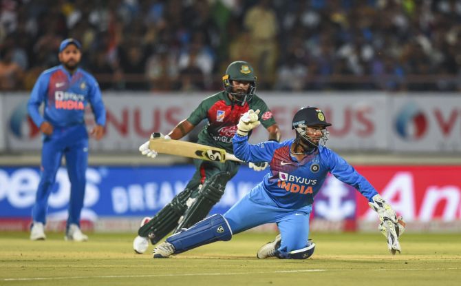 Rishabh Pant attempts a direct hit to run-out Liton Das during the 2nd T20I in Rajkot on Thursday