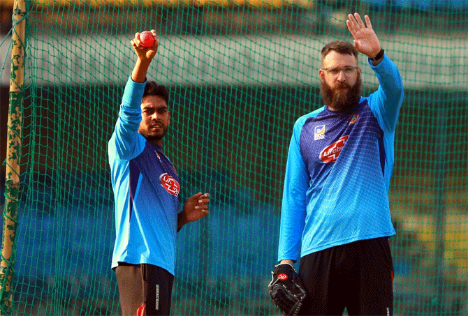 Bangladesh spinner Mehedy Hasan with team consultant Daniel Vettori at a nets session on Monday
