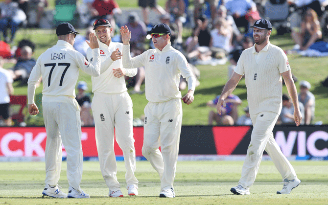 England's Ollie Pope celebrates with teammates after taking the wicket New Zealand's Ross Taylor on Day 2 of the first Test at Bay Oval, Mount Maunganui, Wellington, on Friday