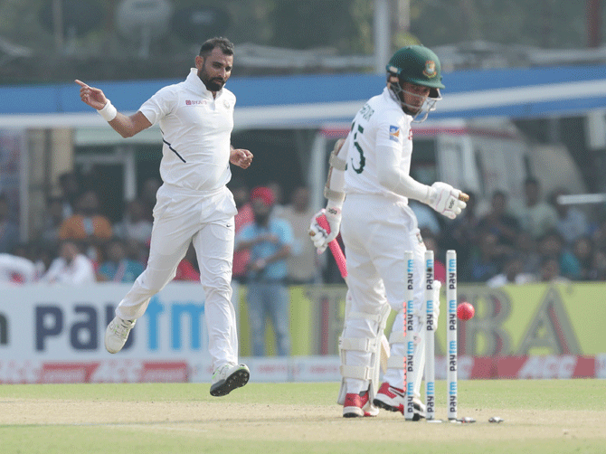 India's Mohammed Shami celebrates as Bangladesh's Mushfiqur Rahim is bowled out