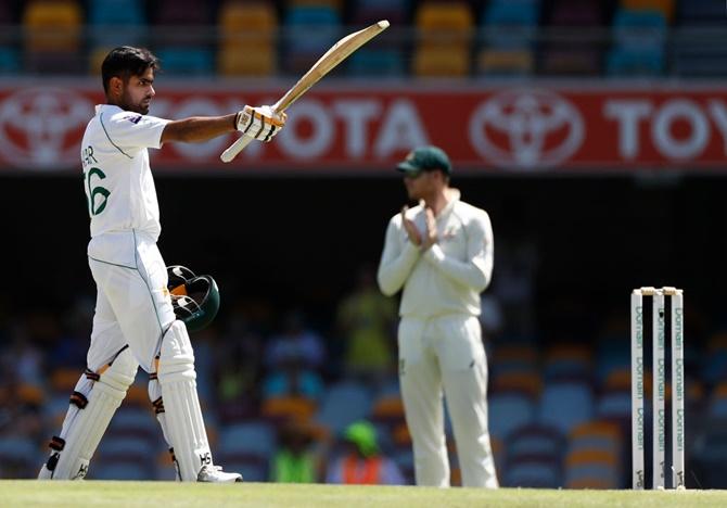 Pakistan's Babar Azam celebrates after completing his century