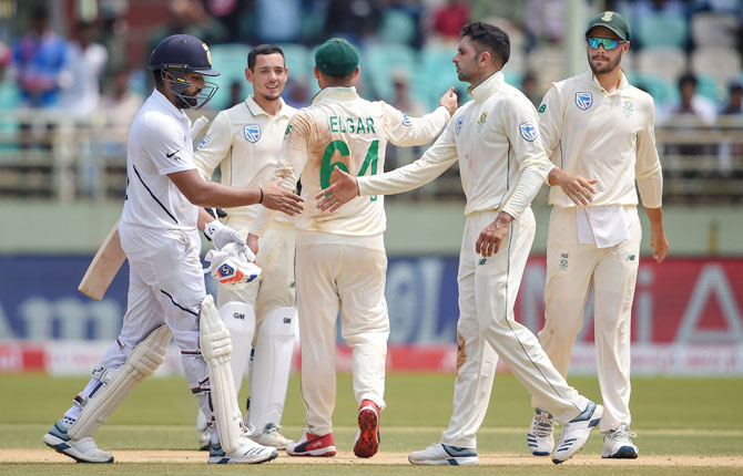 South African players celebrate the dismissal of India's Rohit Sharma on Day 2 of the 1st cricket Test match at Dr YS Rajasekhara Reddy ACA-VDCA Cricket Stadium, in Visakhapatnam, on Thursday