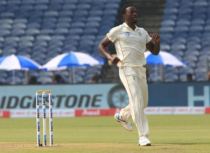 South Africa pacer Kagiso Rabada celebrates after dismissing India opener Rohit Sharma.