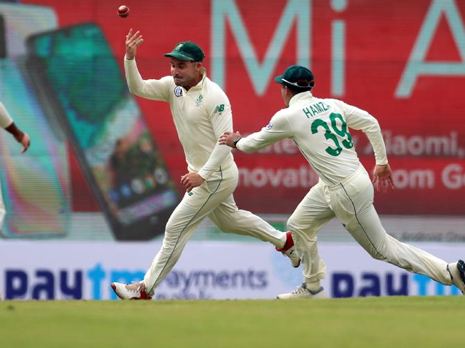 Dean Elgar celebrates catching Mayank Agarwal off the bowling of Kagiso Rabada.