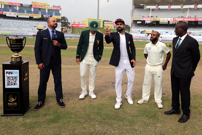 India captain Virat Kohli with South Africa skipper Faf du Plessis as 'proxy skipper' Temba Bavuma, right, calls the toss