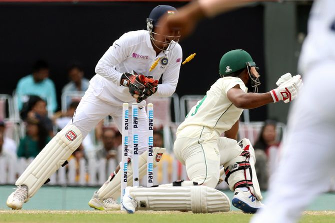 Wriddhiman Saha stumps Temba Bavuma to give debutant Shahbaz Nadeem his first wicket in international cricket.