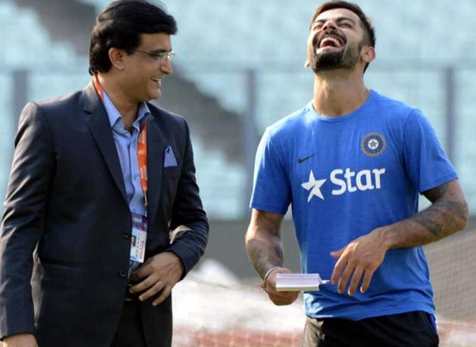 Sourav Ganguly, left, in a light moment with Virat Kohli. Photograph: PTI