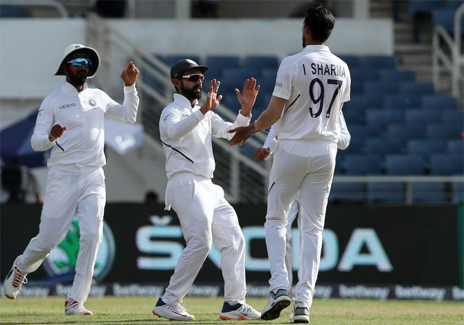 India's Ishant Sharma celebrates on taking the wicket of Windies opener Kraigg Brathwaite