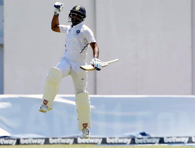 Hanuma Vihari celebrates his maiden Test century during the second Test against the West Indies in Jamaica. Photograph: BCCI