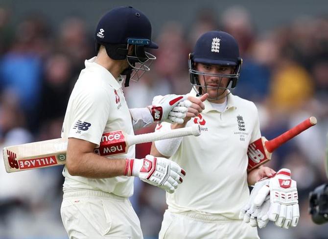 Joe Root and Rory Burns leave the field at tea on Day 3.