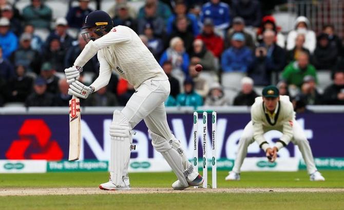 Craig Overton is caught by Australia's Steve Smith off the bowling of Josh Hazlewood.