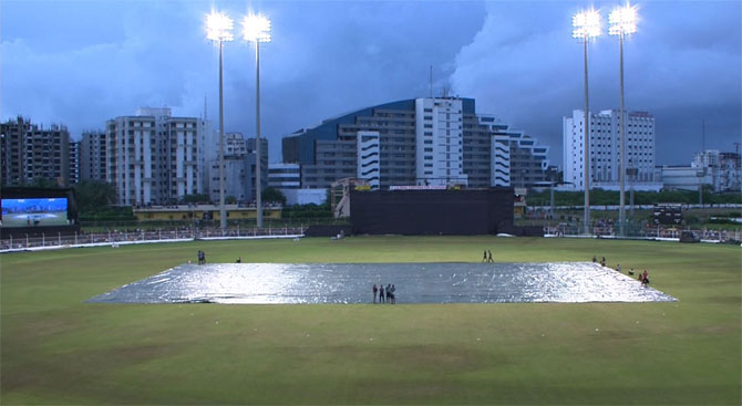 Covers laid on the pitch before the 3rd T201 between India and South Africa in Surat on Sunday