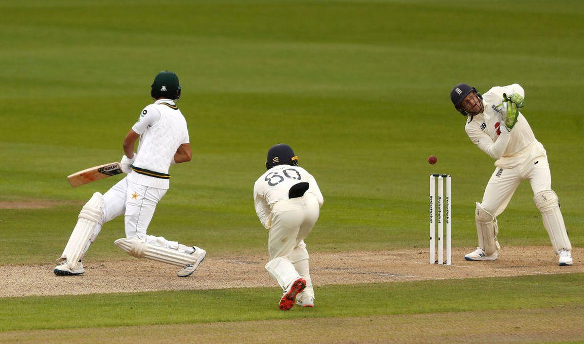 England's Jos Buttler misses the stumping of Pakistan's Shan Masood