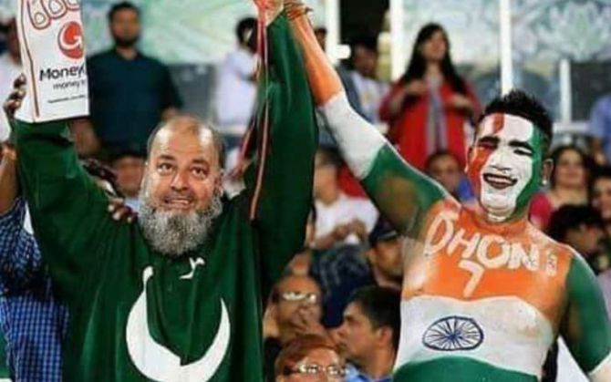 Mahendra Singh Dhoni's Pakistan-born fan, Bashir Bozai aka Chacha Chicago with another Dhoni fan in the stands during a match 