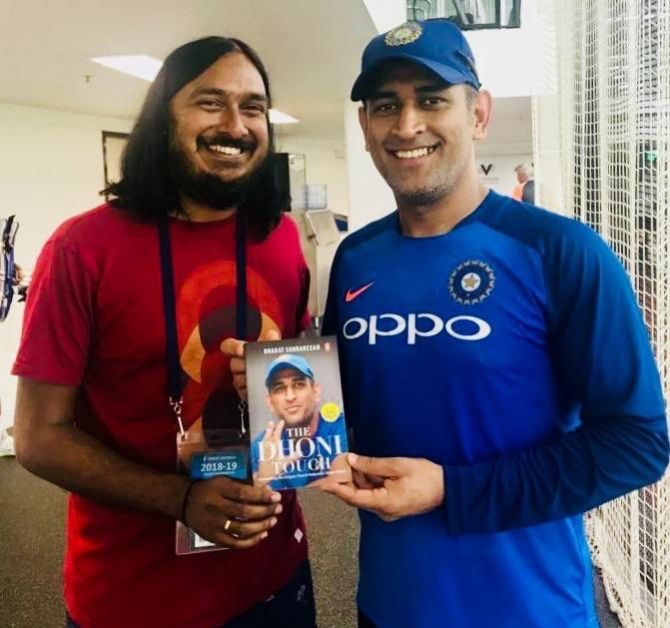 Bharat Sundarsen and MS Dhoni with the book Dhoni 