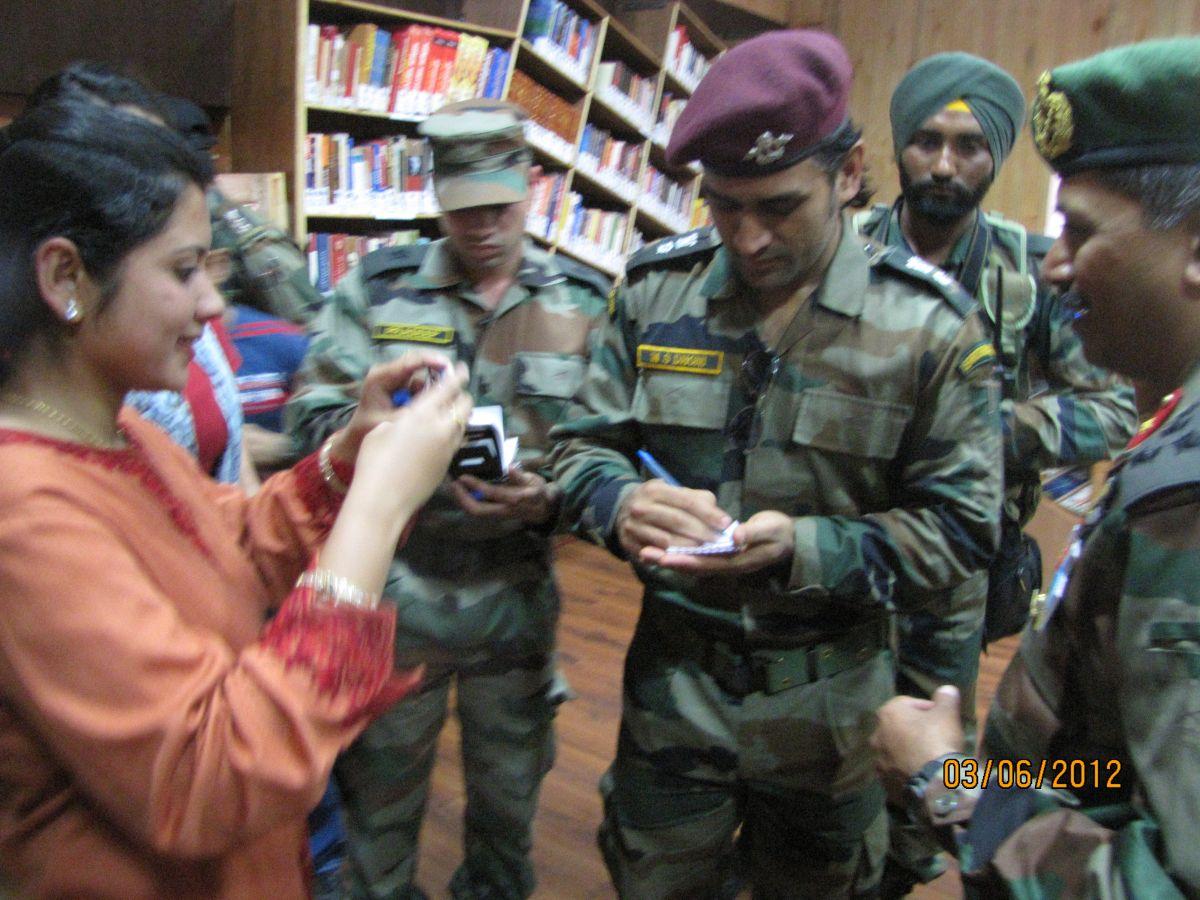 Mahendra Singh Dhoni obliges with an autograph