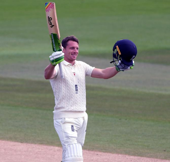 England's Jos Buttler celebrates completing his century on Saturday