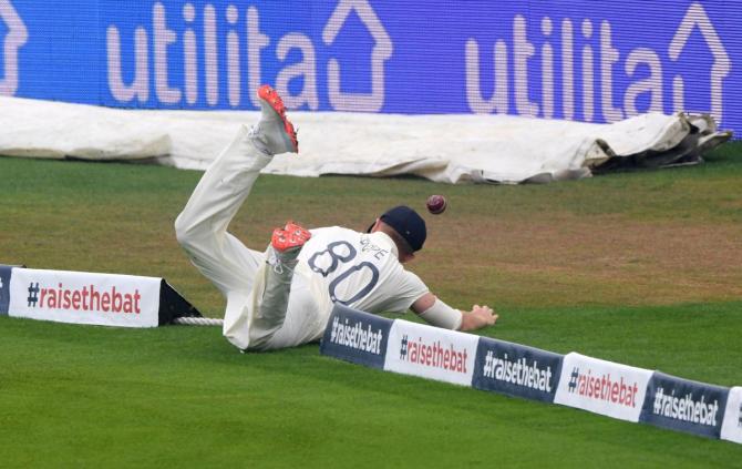 England's Ollie Pope fails to stop a boundary during the Test series against Pakistan 