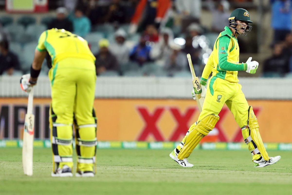 Alex Carey screams in anger after being run out as Glenn Maxwell looks on during the 3rd ODI against India at Manuka Oval in Canberra on Wednesday