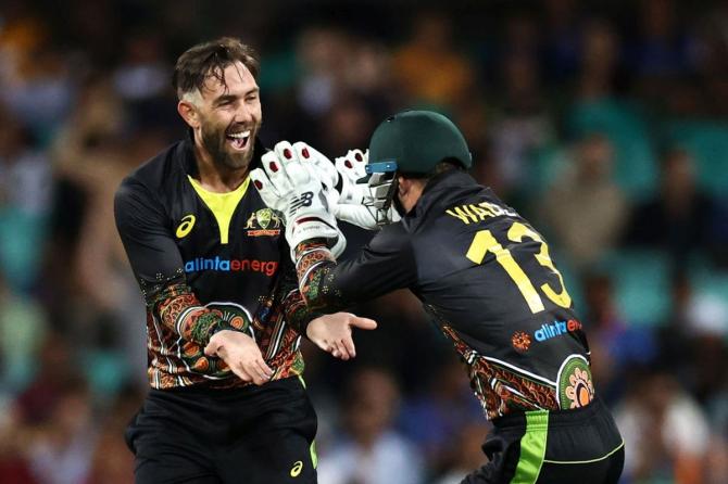 Glenn Maxwell celebrates with Matthew Wade after dismissing KL Rahul