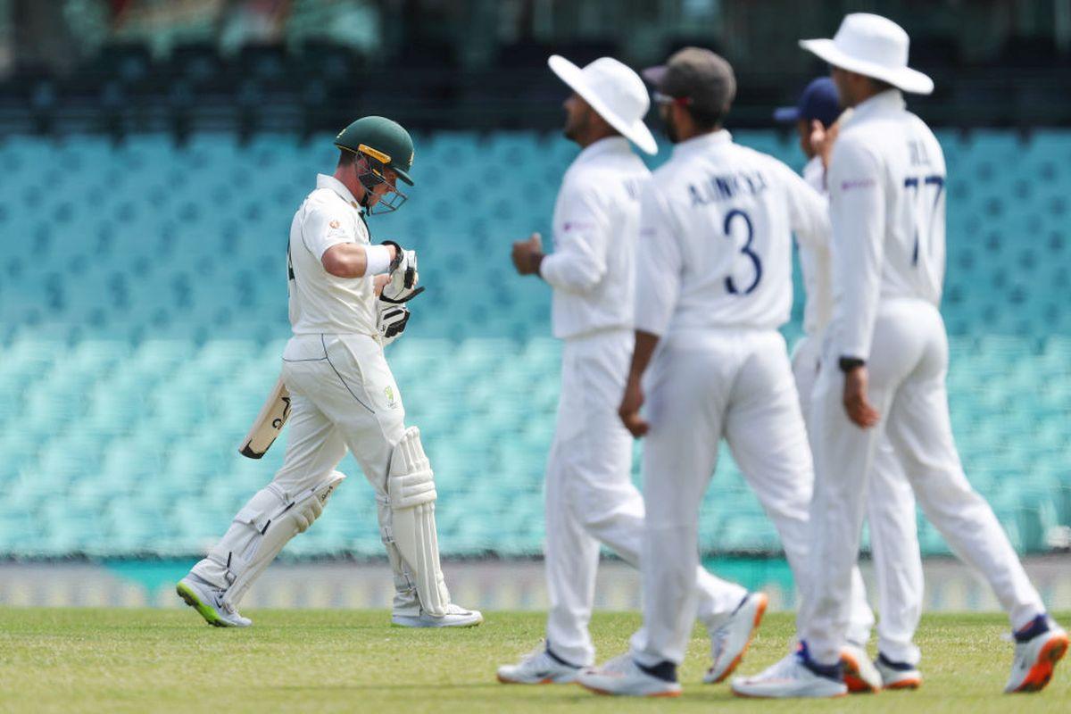 Australia A's Marcus Harris returns to the pavillion on his dismissal