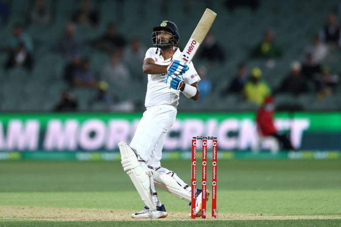 Ravichandran Ashwin hoists the ball over the fence for a six.