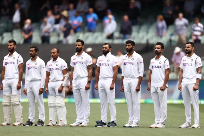 India's players sing the National anthem before the start of the first Test.