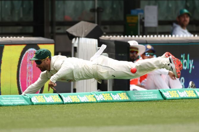 Matthew Wade dives full stretch to save a boundary.