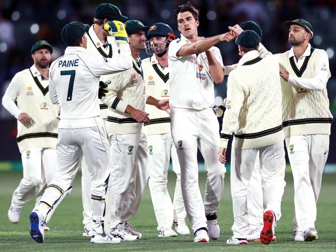  Australia's players celebrate the wicket of opener Prithvi Shaw in India's second innings, on Day 2