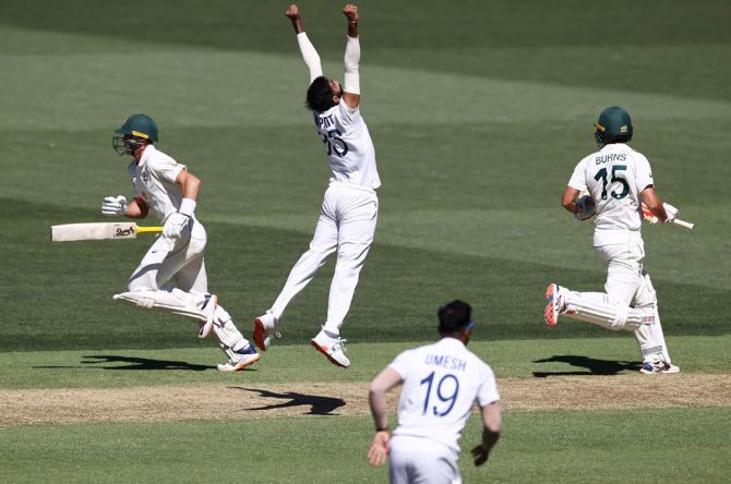 India pacer Jasprit Bumrah celebrates dismissing Australia opener Joe Burns lbw