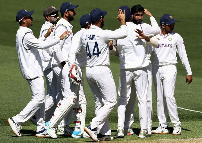 India's players celebrate after Jasprit Bumrah dismisses Mathew Wade leg before wicket