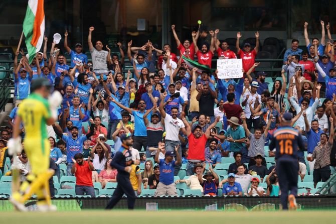 Indian fans react as Virat Kohli takes a catch to dismiss Aaron Finch during the second ODI between Australia and India at the Sydney Cricket Ground, on November 29, 2020.
