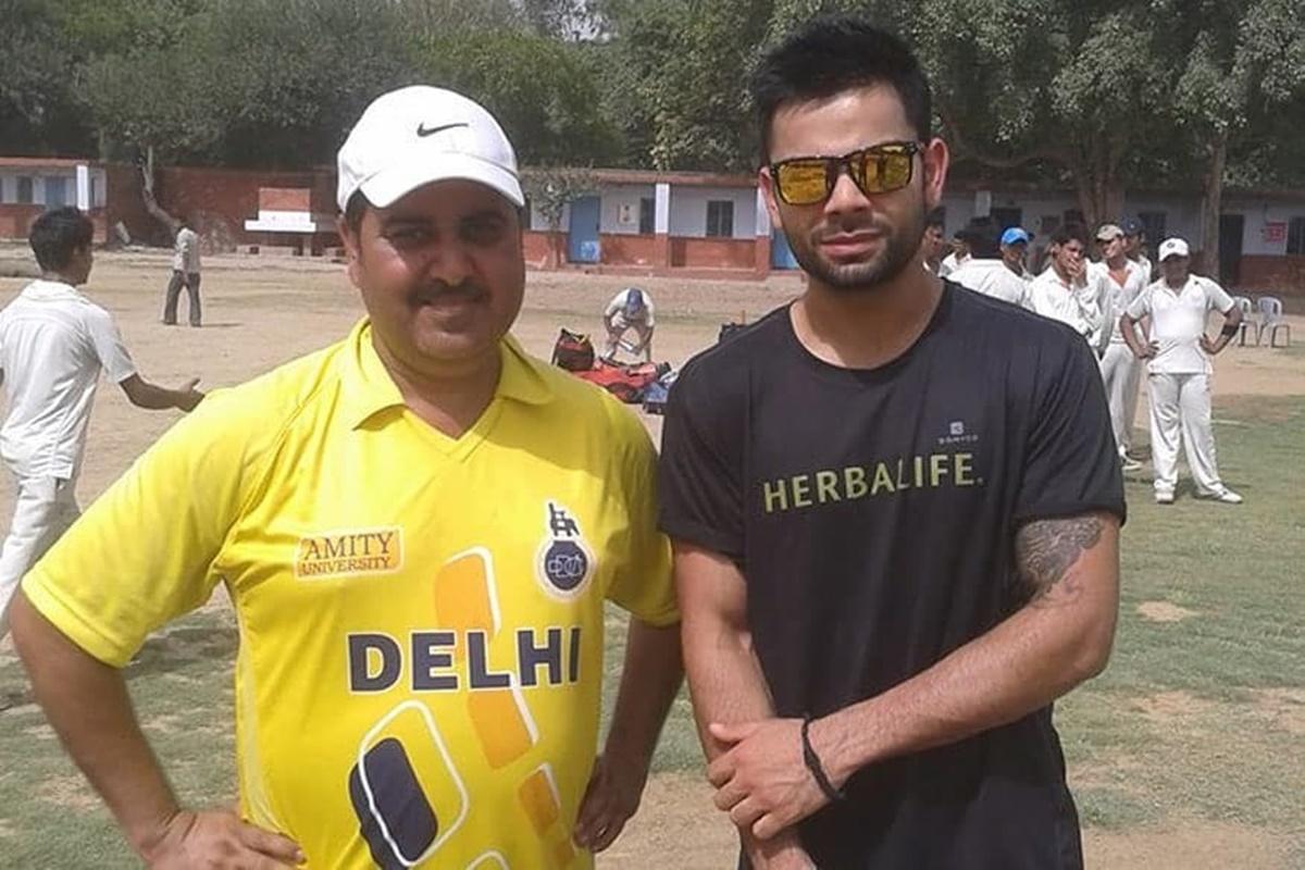 Virat Kohli with Rajkumar Sharma