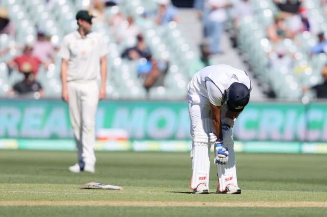 Mohammed Shami reacts after being struck by a ball from Pat Cummins during day three of the first Test at Adelaide Oval on December 19, 2020