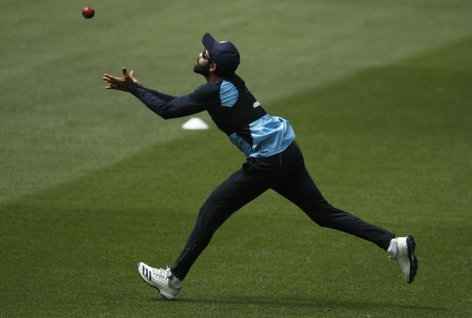 Fit-again Ravindra Jadeja takes a running catch at a nets session on Wednesday