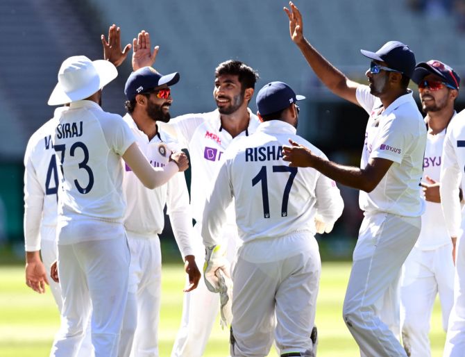 Jasprit Bumrah celebrates getting the wicket of Mitchell Starc