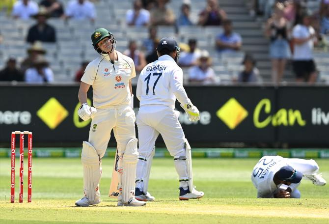 Steve Smith reacts after being caught by Cheteshwar Pujara.