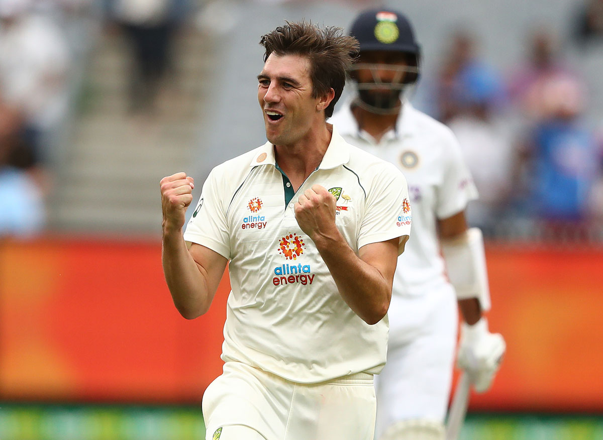 Pat Cummins celebrates after dismissing Cheteshwar Pujara.