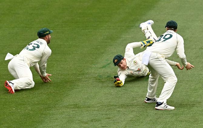 Tim Paine takes the catch to dismiss Cheteshwar Pujara.