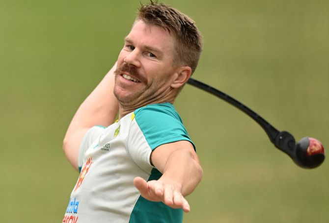 Opening batsman David Warner warms up in the nets during Day 2 of the second Test between Australia and India, at the Melbourne Cricket Ground, on Sunday.
