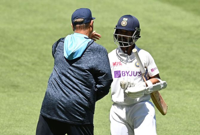 Ajinkya Rahane is congratulated by coach Ravi Shastri after the win in the 2nd Test at the MCG on Tuesday