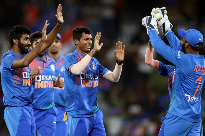 India's players celebrate the dismissal of Ross Taylor
