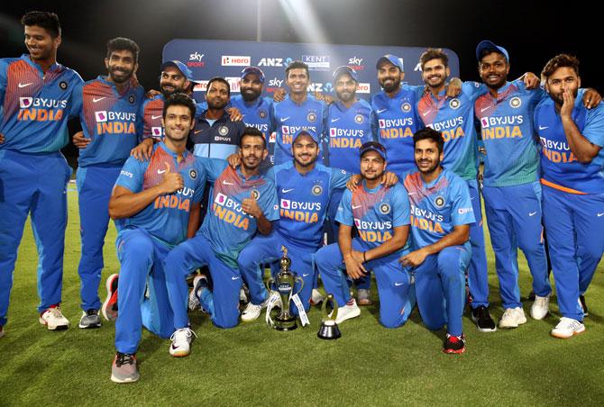 The Indian team poses with the trophy after winning the series against New Zealand 5-0