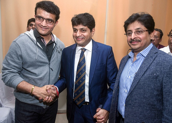 BCCI president Sourav Ganguly congratulates newly-elected Cricket Association of Bengal president Abhishekh Dalmiya and his brother, Snehashis Ganguly, who was elected CAB secretary, in Kolkata, on Wednesday.