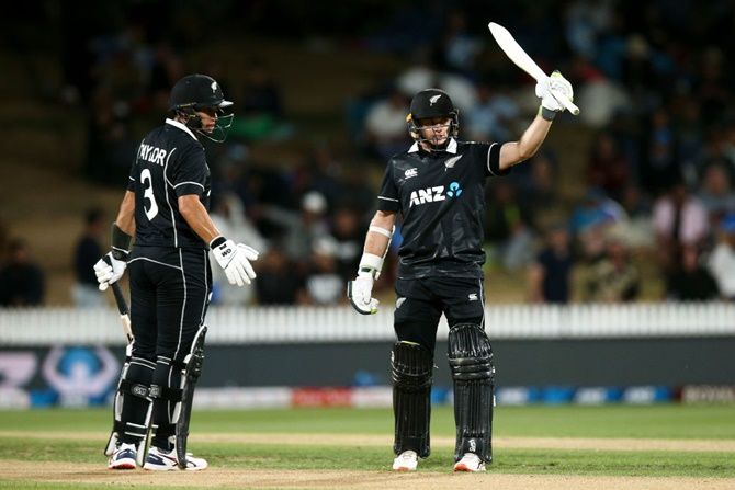 New Zealand's Tom Latham celebrates his half century as Ross Taylor looks on during the first ODI against India, at Seddon Park, in Hamilton, on Wednesday.